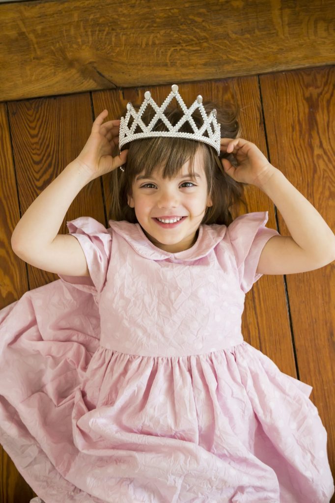 Portrait of smiling little girl dressed up as a princess